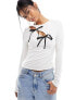 Фото #1 товара ASOS DESIGN cut out long sleeve top with bow detail in ivory