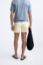 BUTTONED SHORT SWIMMING TRUNKS