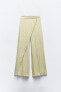 Creased-effect wrap trousers