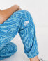 The North Face Essential oversized joggers in blue marble print Exclusive at ASOS