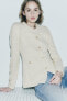 Knit cardigan with padded shoulders and rhinestone buttons