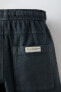 Bermuda shorts with contrast topstitching