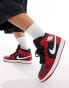 Air Jordan 1 mid trainers in black and red