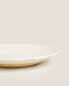 Earthenware side plate with raised-design edge