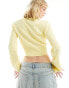 ASOS DESIGN knitted long sleeve top in pointelle stitch with contrast bow detail in lemon