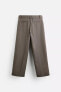 BELTED PLEATED TROUSERS