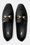 Split leather loafers with chain detail
