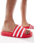 adidas Originals Adilette sliders in coral red