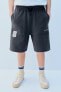 Jogging bermuda shorts with label detail