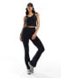 ASOS 4505 soft touch vest top with ruched front and inner bra in black