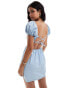 Фото #2 товара ASOS DESIGN puff sleeve denim mini dress with cross back detail in light blue