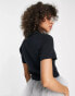 Nike Essential mini swoosh short sleeve polo top in black Черный, S - фото #2