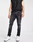 ASOS DESIGN stretch slim jeans in washed black with knee rip