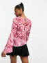 Monki long sleeve boat neck top in red and pink rose print