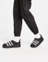 adidas Originals Puffylette in black with white detail