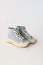 Denim high-top trainers