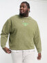 ASOS DESIGN oversized sweatshirt in acid washed green with central embroidery