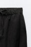 Nylon trousers with zips