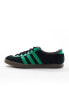 adidas Originals London trainers in black and green