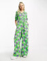 Фото #1 товара Native Youth bold floral belted boilersuit in green and purple