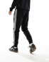 Фото #5 товара adidas Originals three stripe joggers in black