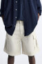 Ripped cargo bermuda shorts