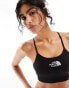 Фото #1 товара The North Face Training seamless performance sports bra in black Exclusive at ASOS