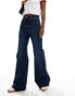 Фото #1 товара Levi's ribcage bells high rise flare jeans in mid blue