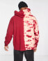 ASOS DESIGN oversized hoodie in red with placement tie dye