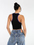 Nicce able cropped vest top in black with chest logo print