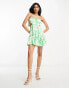 Фото #1 товара ASOS DESIGN ruched bust mini dress with tie detail and cut out in green floral print