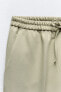 Straight-leg trousers with an elasticated waistband