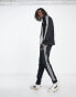 adidas Training 3 stripe tracksuit in black