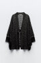 Fringed open knit cardigan