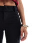 Bershka Petite flared tailored trousers in black