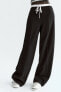 Trousers with satin waistband