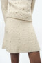 Knit mini skirt with faux pearls
