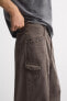 STITCHED WASHED-EFFECT TROUSERS