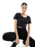 Nike Training One Dri-Fit slim twist back crop t-shirt in black