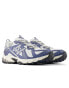 New Balance 610T trainers in blue and white