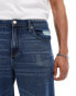 ASOS DESIGN baggy jeans with rips in mid wash blue