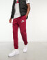 Фото #1 товара Nike Club Swoosh logo joggers in red