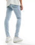 ASOS DESIGN spray on jeans with power stretch in light wash blue