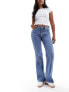 Фото #5 товара & Other Stories low rise flared jeans in mid blue wash