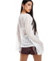 Фото #2 товара ASOS DESIGN textured rib tie front long sleeve flute top in ivory