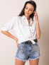 Фото #3 товара Женские джинсовые шорты  Factory Price  с высокой талией, пять карманов, подол с бахромой,  пиринт паетки