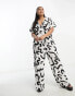 Vero Moda Curve wide leg jumpsuit in mono abstract print