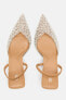 High-heel slingback shoes with faux pearls