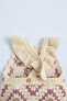 Knit crochet romper with flower detail
