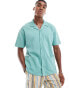 ASOS DESIGN relaxed polo shirt with revere collar in green